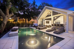 Amazing backyard oasis with pool, hot tub, outdoor kitchen, and more!