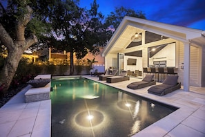 Amazing backyard oasis with pool, hot tub, outdoor kitchen, and more!
