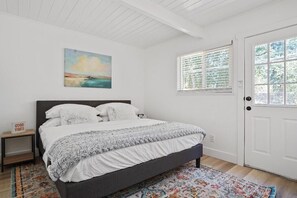 Master bedroom with a king-sized bed.