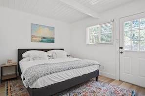 Master bedroom with a king-sized bed.