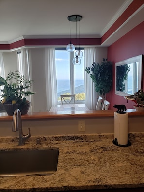 Mountain view from kitchen and dining room. Dining room seats 6.