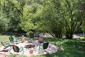 Outdoor fire pit area along East Elk Creek