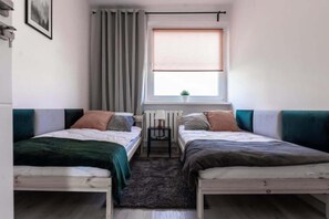 Enjoy the simplicity and comfort of the bedroom's modern design. 