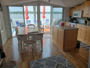 Dining and kitchen with double sliding doors onto deck - great views
