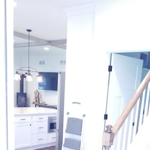 Stair to 2nd floor, door to Laundry and Kitchen.