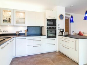 Cabinetry, Countertop, Property, Kitchen Appliance, Home Appliance, Kitchen Stove, Wood, Kitchen, Lighting, Interior Design