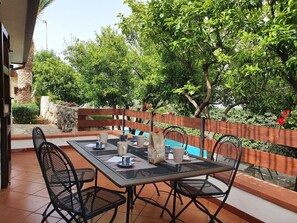 Furniture, Outdoor Furniture, Chair, Table, Outdoor Table, Kitchen & Dining Room Table, Shade, Garden, Wood Stain, Backyard