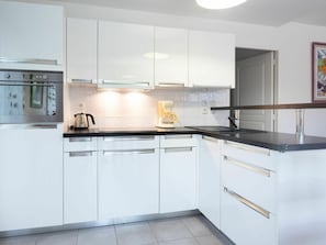 Cabinetry, Countertop, Kitchen Sink, Kitchen Appliance, Kitchen, Home Appliance, Sink, Kitchen Stove, Lighting, Interior Design