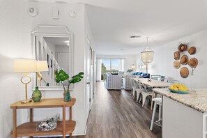 The main floor has the common areas - kitchen, dining, living, and porch access.