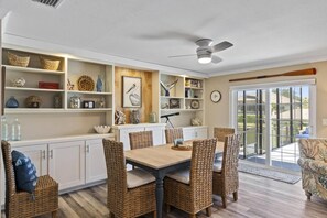 Enjoy dinner at the dining table with stunning views of the canal.