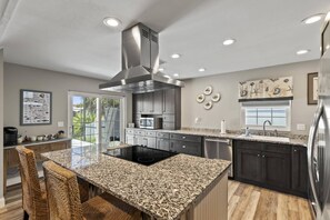 Enjoy a fully stocked kitchen designed with the chef in mind!