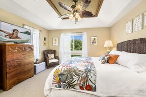 Bedroom with TV, Ceiling Fan, and King Bed at Mauna Lani Hawai'i Vacation Rentals