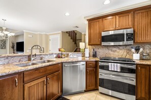Kitchen with Wrap around Counters and Wooden Cabinets