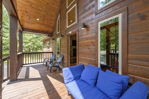 Daybed and seating on front porch. Enjoy a cup of coffee and take in the views!