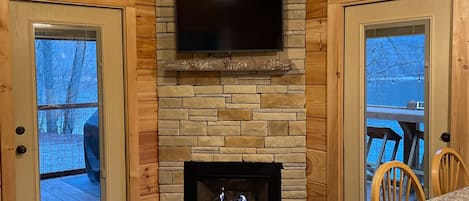 Brand new gas log floor to ceiling fireplace.