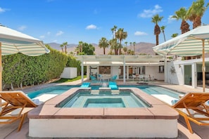 Private secluded pool with views of mountains, sky and palm trees