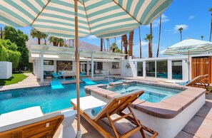 Private secluded pool with views of mountains, sky and palm trees