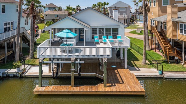 Relaxing view from the canal side of Water’s Edge. Grill, swim, kayak and relax.