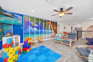 2nd floor living Rm; smart TV, play Mart, Creativity Center, nest chair, beach 