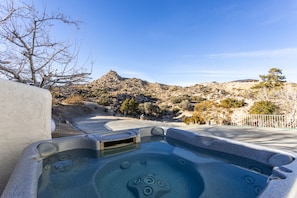 Relax in the hot tub while enjoying the view.