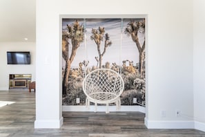 Our hammock swing chair is flanked by a desert-scape.