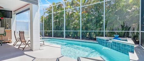 Experience the beautiful 2-story lanai, complete with private heated pool, in this unique Bonita Spring home.