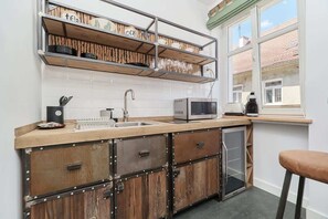 The kitchenette's practical layout maximizes space and functionality.