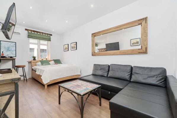 Relax in the stylish living area with a comfortable corner sofa and modern decor.