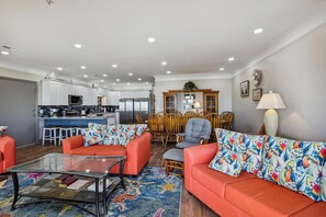 The ocean front living room is well-appointed with comfortable furnishings.