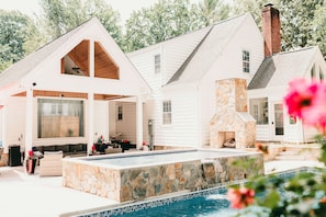 Look at all that seating!  A luxurious lounge seating area and custom fireplace.