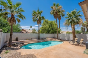 Private back yard with patio and pool.