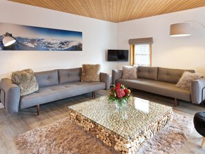 Brown, Couch, Furniture, Interior Design, Rectangle, Living Room, Floor, Plant, Flooring, Wood