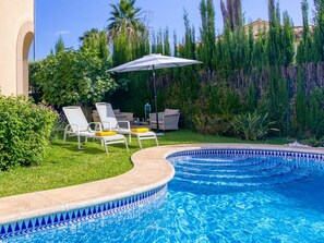 Water, Plant, Property, Sky, Swimming Pool, Azure, Blue, Tree, Outdoor Furniture, Umbrella