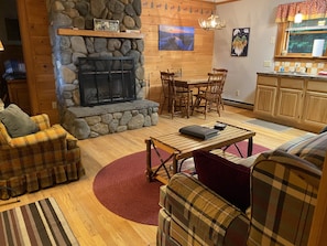 Living room with stone fireplace