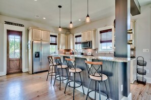 Additional seating for 4 at the kitchens beautiful island