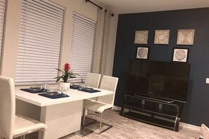 Dinning table with a LG 65” HD  with Roku 