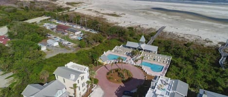 Coast Cottages feature a large community pool by the ocean and access to the beach via boardwalk.  This home does not have ocean views.