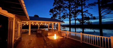 Rear patio looking at Covered outside Kitchen and propane Fire Pit. 