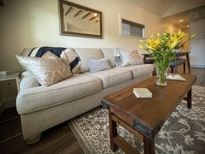 Living Room- Couch that transforms into a queen-sized bed at Carpenter Cottage