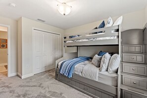 Family paradise with a luxury twin bed over full size bed bunk, with an additional trundle bed.