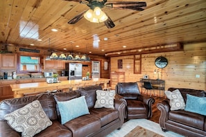 Open floorplan with comfy couches. Sit down, relax, enjoy the awesome views, and connect with great conversations.
