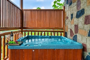 Hot tub with a view and with safety railing located on the lower deck. Step right in.