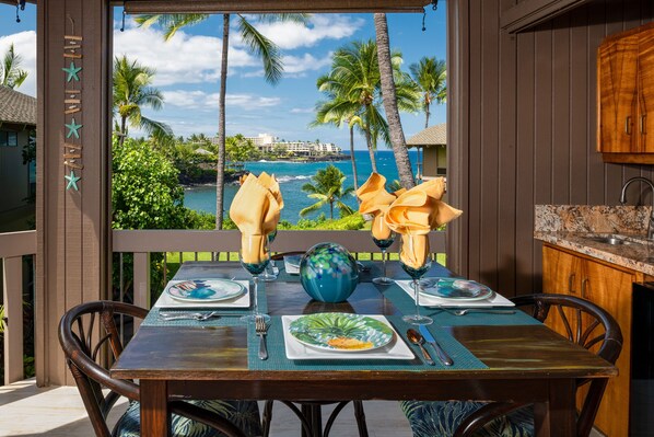 Enjoy Kona coffee and island fruit while feeling the ocean breezes