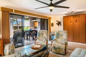 Right side of your spacious living room with closed Queen Murphy bed and lanai