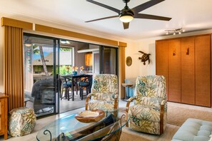 Right side of your spacious living room with closed Queen Murphy bed and lanai