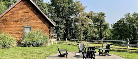 Fire pit and side of cabin