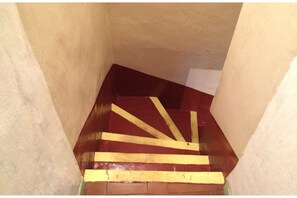 The winding staircase to the first floor.
