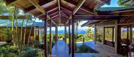 Covered walkways join the 3 wings of the house. Here, standing at the entrance..