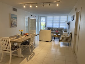 Dining room and living room with pull out sofa.