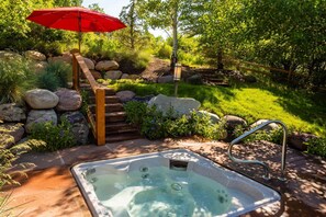 The private hot tub is located off of the master bedroom on the upper level of the outdoor patio area.